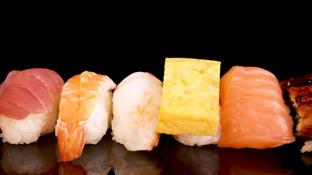 Rotating Assorted Sushi and Sashimi Set on Black Background