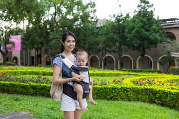 Young mother enjoying outdoor time with baby