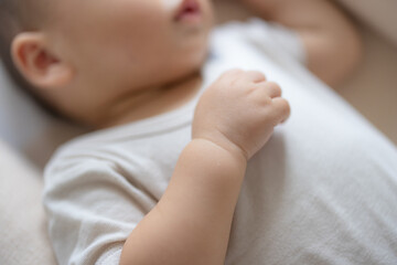 Close up of little baby hand resting