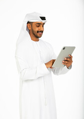 Portrait of an emirati man on a white background using an ipad.