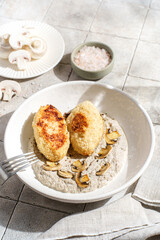 cutlets with mushroom puree and champignons