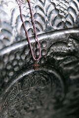 Baptismal font with blessing water and pectoral cross.
