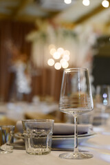 wedding decorations with flowers and candles on the ceiling in a restaurant