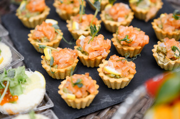 delicious tartare with salmon and shrimp on table