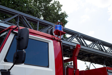 Blue round siren on roof of fire service to increase visibility in city traffic during the rescue...