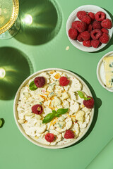 fresh cauliflower salad with dor blue cheese and raspberries