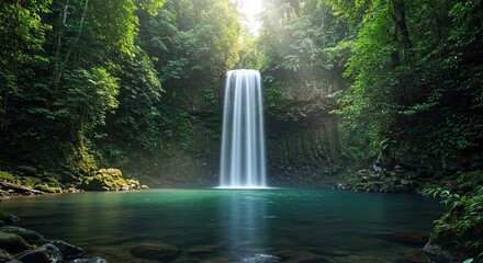 Tranquil Waterfall Flowing Into Turquoise Pool Surrounded by Lush Green Forest