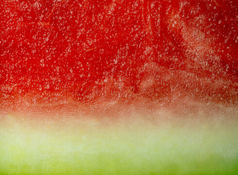 Slice of watermelon close up macro texture red and green