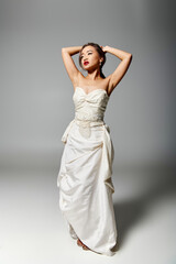 Fototapeta premium Graceful moment captured of a radiant young bride in an elegant white wedding dress