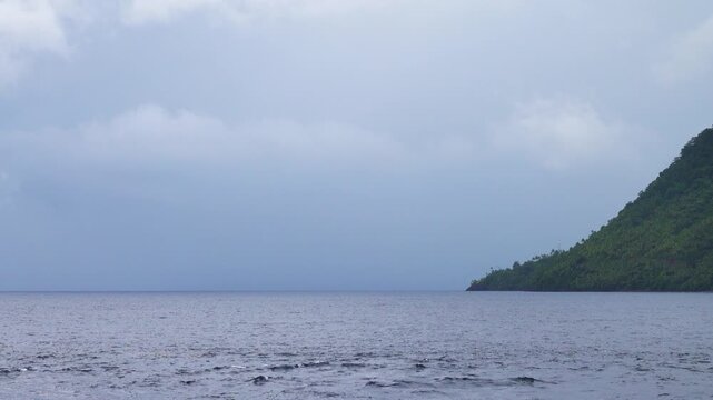 Exotic islands in the tropical Java Sea. Indonesia, Mountain rainforests on the slopes, evergreen plant. Indian Ocean. Surabaya. Cruise sea voyage place