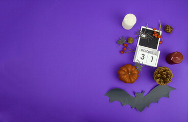 Halloween background with pumpkins, bat and calendar.