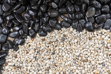 Close up black stones and white gravel texture background for wallpaper.