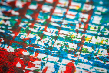 Extreme close up of colorful acrylic paint texture showing brush strokes. Selective focus.