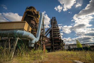Abandoned Heavy Industrial Ruins with Large Blast Furnace in Steelworks