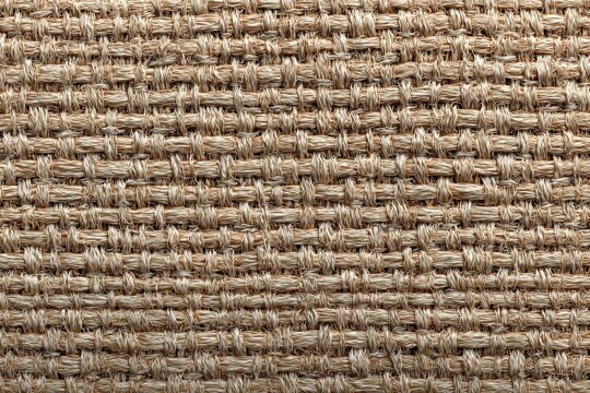 Tightly woven fabric showcasing intricate details and creating a textured pattern
