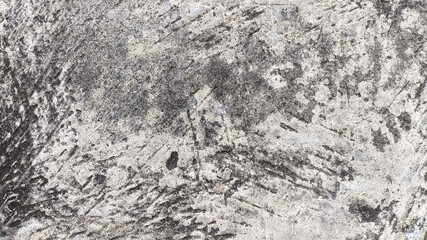 Grime and cracks on weathered concrete wall texture. Perfect for industrial visuals or aged building backgrounds.