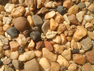 Colorful small stone gravel texture background, decoration in the garden