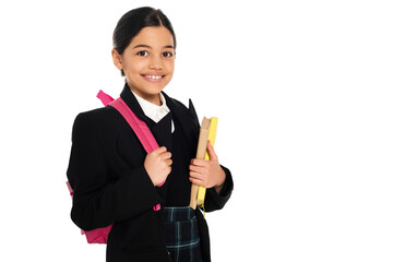 Preteen schoolgirl embraces back to school excitement in a bright studio setting