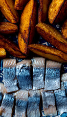 Herring and baked potatoes on a craft plate