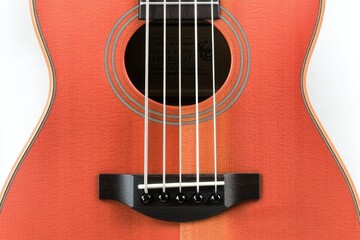 Obraz premium Close-up of an orange ukulele with four strings and a black tailpiece against a white background, suitable for music, instrument, leisure scenes