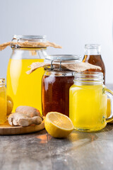 Colorful Kombucha Jars and Bottles on wooden table