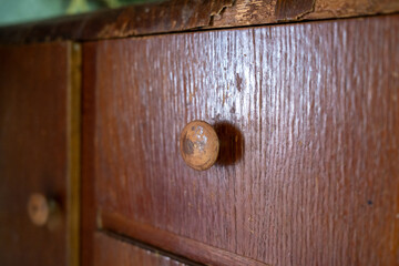 Beautiful antique wooden chest of drawers. Details of antique wooden furniture. Soviet furniture....