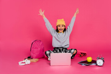 Stylish preteen girl eagerly prepares for school in vibrant studio setting