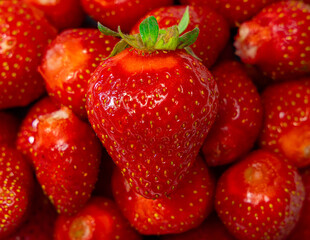 Juicy seasonal strawberries close up macro texture