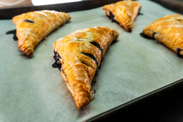 Blueberry and Apricot Jam Triangles Pie. Puff Pastry. Dessert