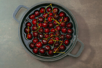 Juicy seasonal black cherries close-up