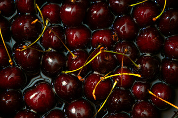 Juicy seasonal black cherries close-up