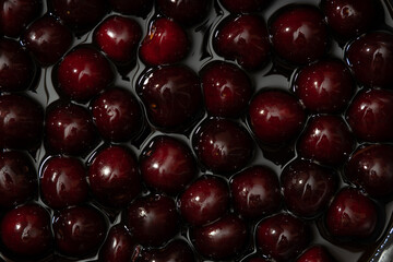 Juicy seasonal black cherries close-up