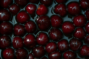 Juicy seasonal black cherries close-up