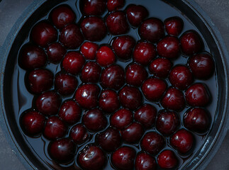 Juicy seasonal black cherries close-up