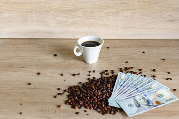 Morning espresso with coffee beans and cash on rustic wooden surface