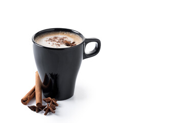Chai Latte in Black Mug with cinnamon and star anise isolated on white background. Copy space