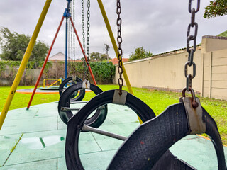 Public children's playground park on a cloudy day