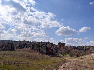 a part of the valley of frig and strange rocks under the cloudy sky