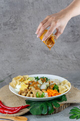 Traditional Indonesian Gado-Gado Salad with Peanut Sauce, Vegetables, and Boiled Egg