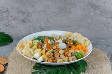 Traditional Indonesian Gado-Gado Salad with Peanut Sauce, Vegetables, and Boiled Egg