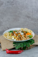Traditional Indonesian Gado-Gado Salad with Peanut Sauce, Vegetables, and Boiled Egg