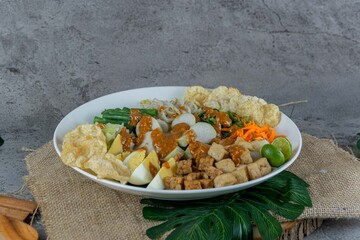 Traditional Indonesian Gado-Gado Salad with Peanut Sauce, Vegetables, and Boiled Egg