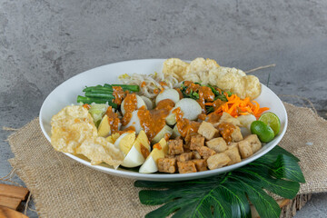 Traditional Indonesian Gado-Gado Salad with Peanut Sauce, Vegetables, and Boiled Egg