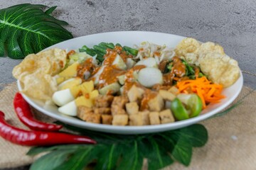 Traditional Indonesian Gado-Gado Salad with Peanut Sauce, Vegetables, and Boiled Egg