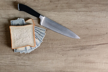 Money sandwich made of dollars with a knife