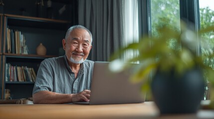 Elderly man working on laptop in cozy home office relaxed environment professional setting