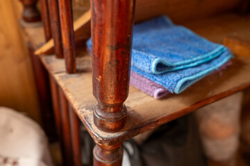 Wooden Soviet shelf. Interior of a Soviet dacha. Detail of antique wooden furniture.
