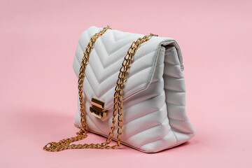 Stylish White Quilted Handbag with Gold Chain Display