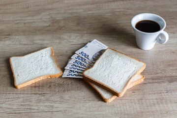 rich breakfast from Money Tender sandwich Ukrainian hryvnia and morning coffee