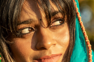 Serene woman in colorful dupatta outdoors